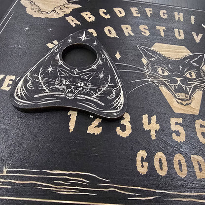 Ouija board with a black cat illustration on a dark background