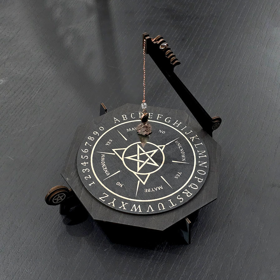 Unique engraved pendulum board in black wood. 