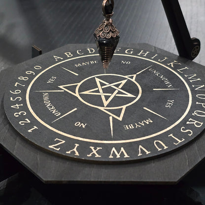 Unique engraved pendulum board in black wood. 